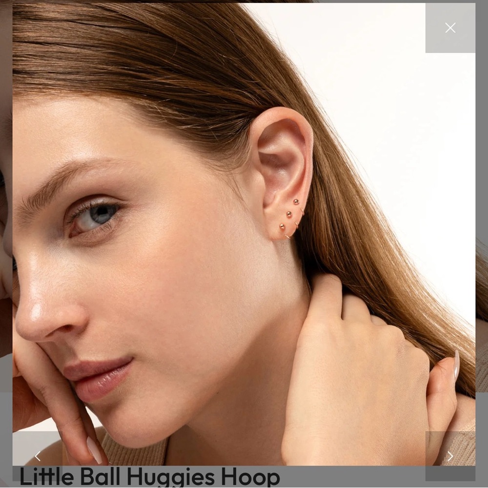 Two rose gold ball stud earrings